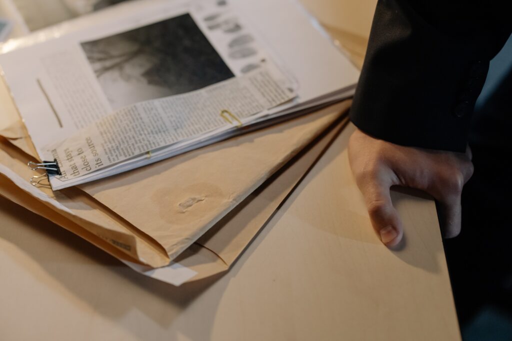 Folders with case evidence sitting on a table