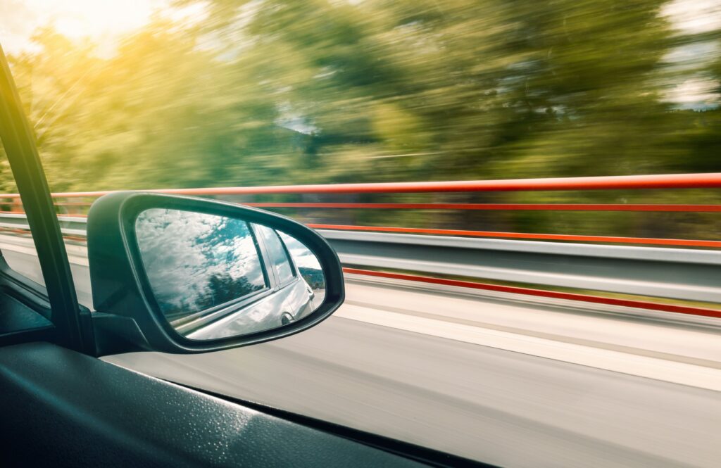 Car side mirror and road