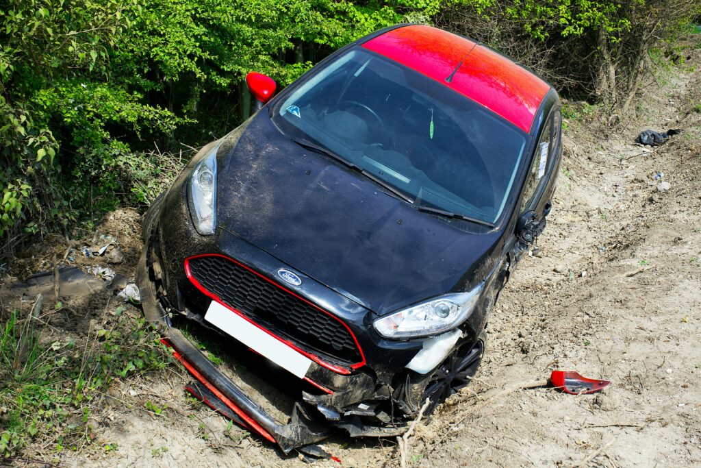 Black vehicle crashed in a ditch