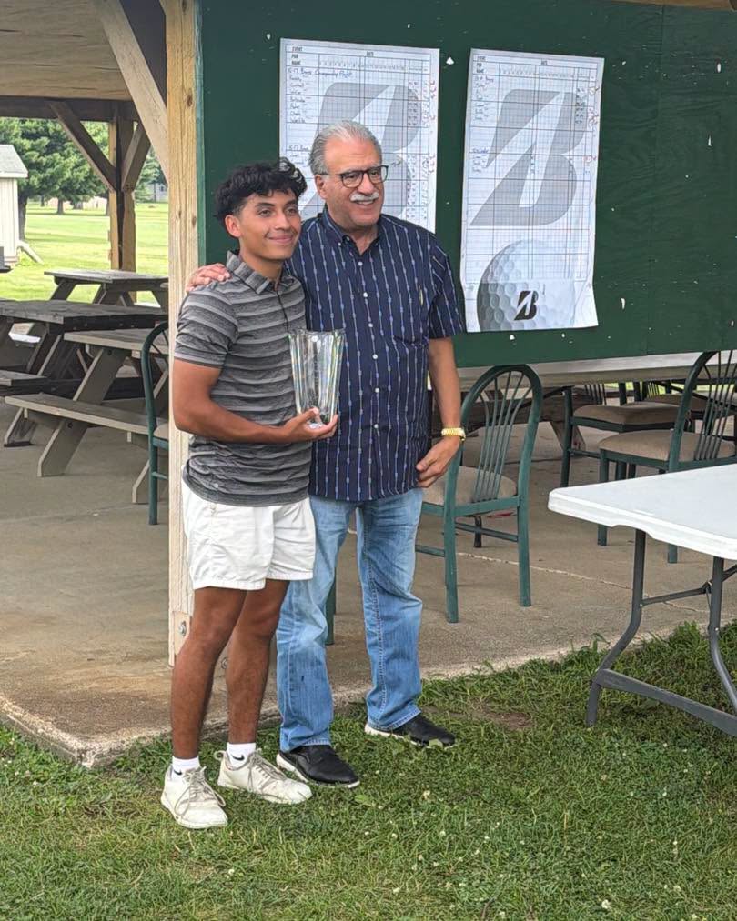 Anthony Tanoos of Fleschner, Stark, Tanoos & Newlin presents the Travis J. Smith Outstanding Junior Golfer Award to Austin Cheek