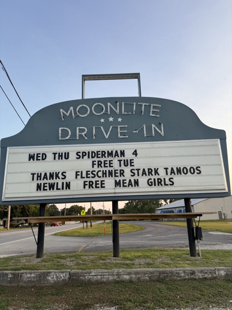 Moonlite Drive-In marquee thanking Fleschner, Stark, Tanoos & Newlin for a free showing of Mean Girls
