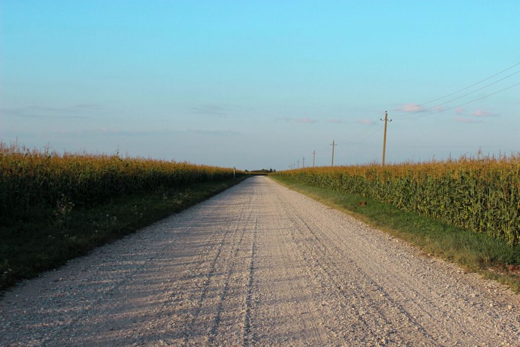 Rural country road running through farm fields near Cloverdale, Indiana